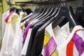 Colorful Women`s dresses on hangers in a fashion store. Shop stylish clothes, close-up. - image. Royalty Free Stock Photo