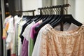 Colorful Women`s dresses on hangers in a fashion store. Shop stylish clothes, close-up. - image. Royalty Free Stock Photo