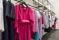 Colorful Women`s dresses on hangers in a fashion store. Shop stylish clothes, close-up. - image. Royalty Free Stock Photo