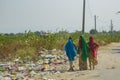 Colorful Women in Saris and Colorful Trash