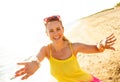 Smiling young woman on beach in evening having fun time Royalty Free Stock Photo