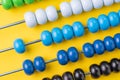 Colorful wooden abacus beads on yellow background, business financial or accounting cost and expense calculation concept, or use Royalty Free Stock Photo