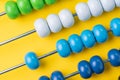 Colorful wooden abacus beads on yellow background, business financial or accounting cost and expense calculation concept, or use Royalty Free Stock Photo