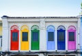 Colorful wooden arched window on white cement wall in chino Portuguese style at Phuket old town, Thailand Royalty Free Stock Photo