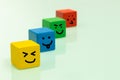 Colorful wooden blocks with emoticons Positive emotions, smiles, facial expressions, Concept of positive thinking and expressing Royalty Free Stock Photo