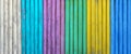 Colorful wooden boards painted in white, cyan, purple, green, yellow and blue colors. Royalty Free Stock Photo