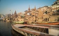 Colorful wooden boats docked along the shore of the Ganges River, at one of the many ghats in Varanasi, India. Royalty Free Stock Photo