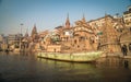 Colorful wooden boats docked along the shore of the Ganges River, at one of the many ghats in Varanasi, India. Royalty Free Stock Photo