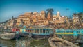 Colorful wooden boats docked along the shore of the Ganges River, at one of the many ghats in Varanasi, India. Royalty Free Stock Photo