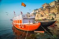 Colorful wooden boats docked along the shore of the Ganges River, at one of the many ghats in Varanasi, India. Royalty Free Stock Photo