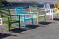 Colorful wooden chairs. A row of colorful chairs. Colorful wooden chairs on various background, can be use for background or print Royalty Free Stock Photo
