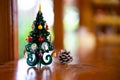 Colorful wooden Christmas tree on the table in the morning atmosphere Royalty Free Stock Photo