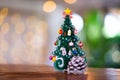 Colorful wooden Christmas tree on the table in the morning atmosphere Royalty Free Stock Photo