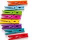 Colorful wooden clothespins on white background with copy space/diversity concept