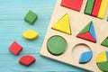 colorful wooden cubes on blue wooden background. Top view. Toys in the table