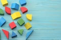 colorful wooden cubes on blue wooden background. Top view. Toys in the table Royalty Free Stock Photo