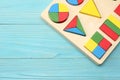 colorful wooden cubes on blue wooden background. Top view. Toys in the table