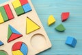 colorful wooden cubes on blue wooden background. Top view. Toys in the table