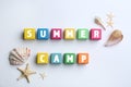 Colorful wooden cubes with phrase SUMMER CAMP on white background Royalty Free Stock Photo