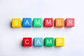 Colorful wooden cubes with phrase SUMMER CAMP on background, top view Royalty Free Stock Photo