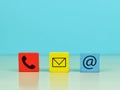 Colorful wooden cubes with symbol telephone, email and address. Royalty Free Stock Photo
