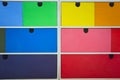 colorful wooden drawers in various colors, modern interior background texture retro