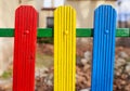 Colorful wooden fence painted in blue, yellow and red Royalty Free Stock Photo