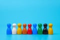 Colorful wooden figures in line: Diversity, inclusion, and teamwork concept Royalty Free Stock Photo