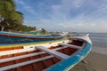 Colorful wooden fisher boats aligned on the beach