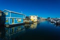 Colorful wooden floating houses on sunny summer day with blue sky