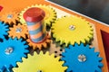 Colorful wooden gears with twisting bar for kid activity and lea Royalty Free Stock Photo