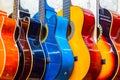 colorful wooden guitars hanging on wall of store showroom Royalty Free Stock Photo