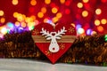 Colorful wooden heart shaped Christmas ornament. Christmas composition on blurred lights background Royalty Free Stock Photo