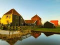 Colorful wooden houses built on the Dutch canals at sunset Royalty Free Stock Photo