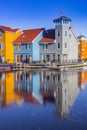 Colorful wooden houses in the frozen Reitdiephaven in Groningen Royalty Free Stock Photo