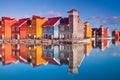 Colorful wooden houses near water