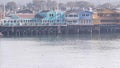 Colorful wooden houses on piles or pillars, Old Fisherman's Wharf, Monterey bay.