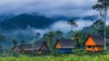 Colorful Wooden Huts In Misty Rainforest Landscape Royalty Free Stock Photo