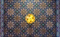 Colorful wooden ornate ceiling with floral and geometrical patterns at historic Manial Palace of Prince Mohammed Ali, Cairo, Egypt