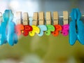 Colorful of wooden Paper clip attached to the rail Royalty Free Stock Photo