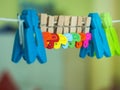 Colorful of wooden Paper clip attached to the rail Royalty Free Stock Photo