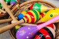 Colorful wooden rattles in a basket on the market for handmade souvenirs in Tryavna, Bulgaria. Maracas for baby toy Royalty Free Stock Photo