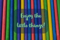 Colorful wooden sticks with text ENJOY THE LITTLE THINGS Royalty Free Stock Photo