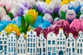 Wooden tulips with small souvenir Amsterdam canal houses Royalty Free Stock Photo