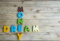 Colorful wooden word Dream and Money on wooden floor1 Royalty Free Stock Photo