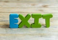 Colorful wooden word Exit on wooden floor7