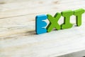 Colorful wooden word Exit on wooden floor4