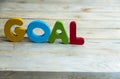 Colorful wooden word Goal on wooden floor1