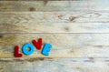 Colorful wooden word Love on wooden floor1