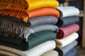 Colorful wool or alpaca blankets stacked in pile. Generative AI Royalty Free Stock Photo